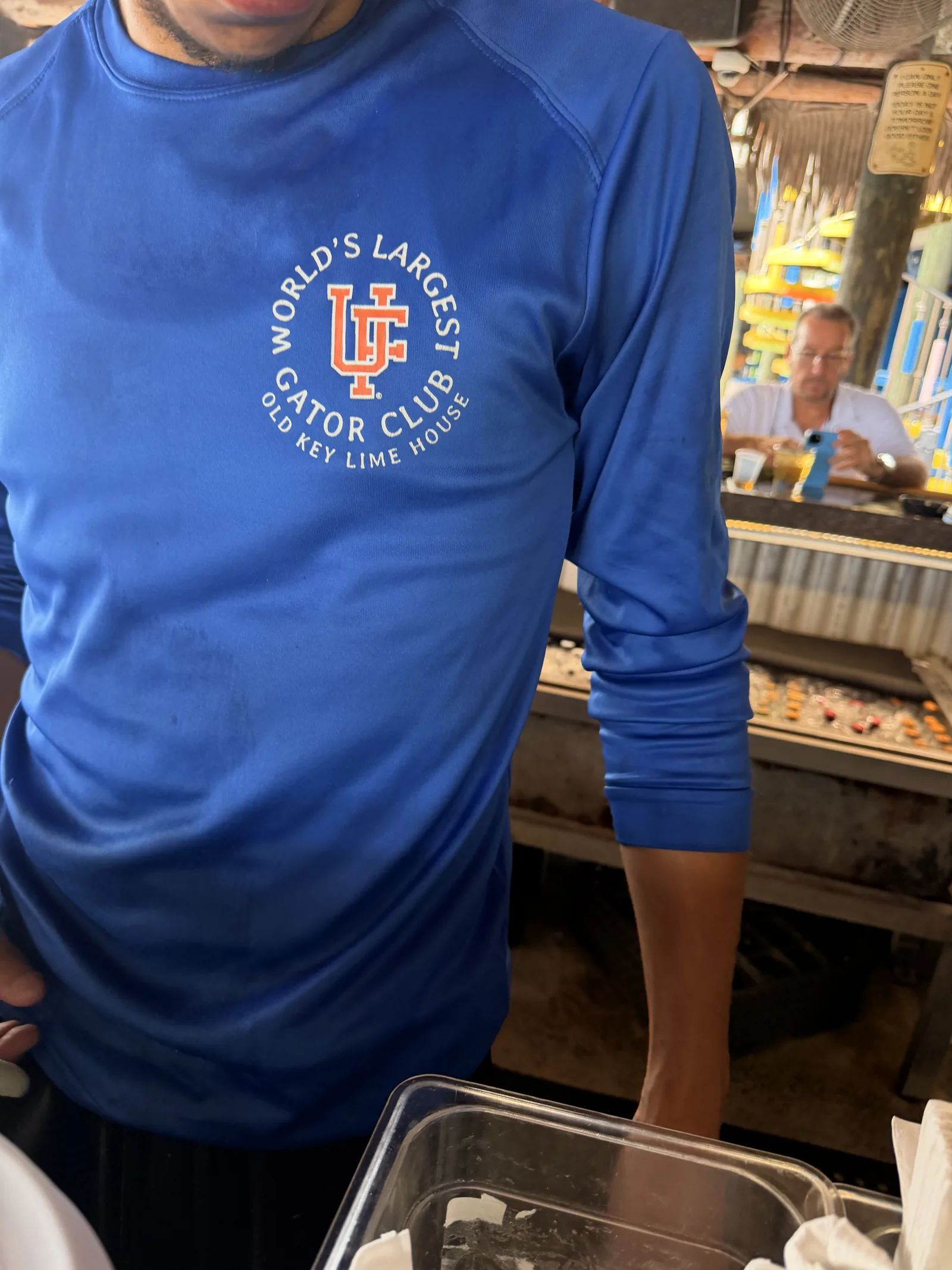 A World's Largest Gator Club shirt from Old Key Lime House, the dining room behind